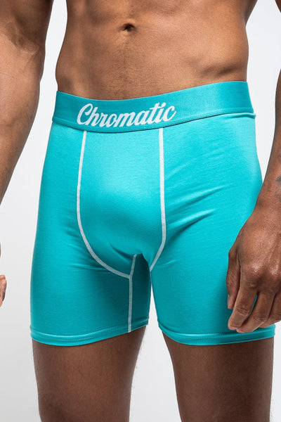 Torquoise boxer briefs with 'Chromatic' waistband on a white background